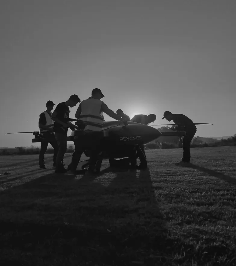Psyche Aerospace employees working on one of the drones